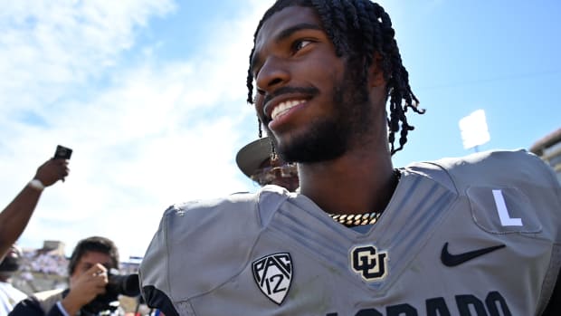 Boulder, Colorado, USA; Colorado Buffaloes quarterback Shedeur Sanders (2) smiles as he walks off the field after the game against the USC Trojans at Folsom Field